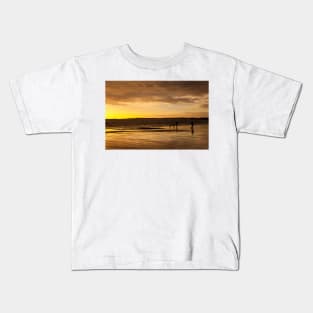 Dog walkers on the beach at sunrise Kids T-Shirt